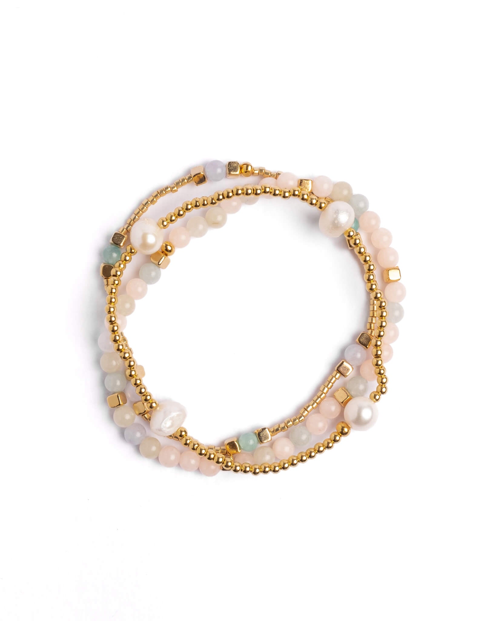 Set of three beaded bracelets with gold accents on a white background