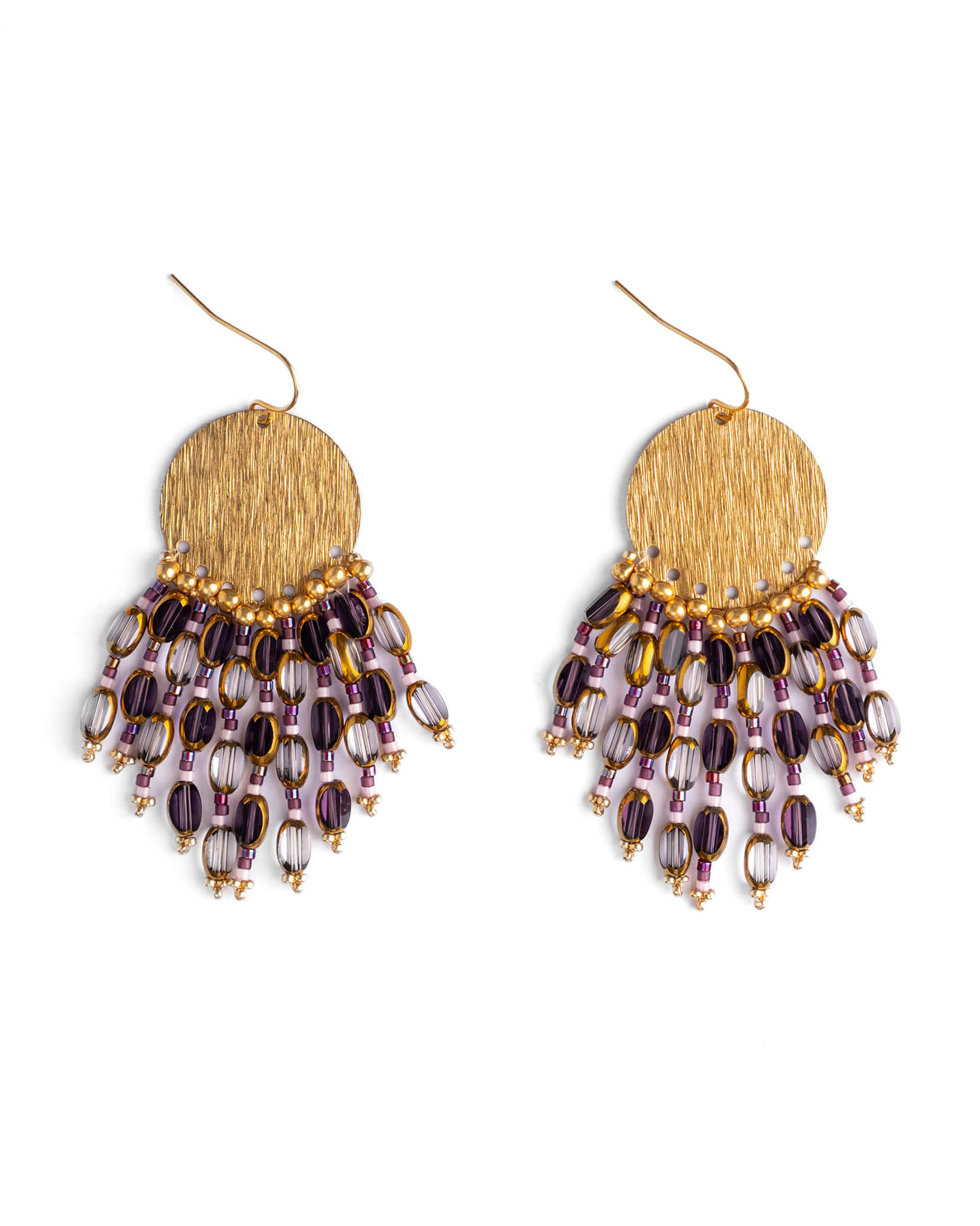 Gold and purple beaded earrings on a white background