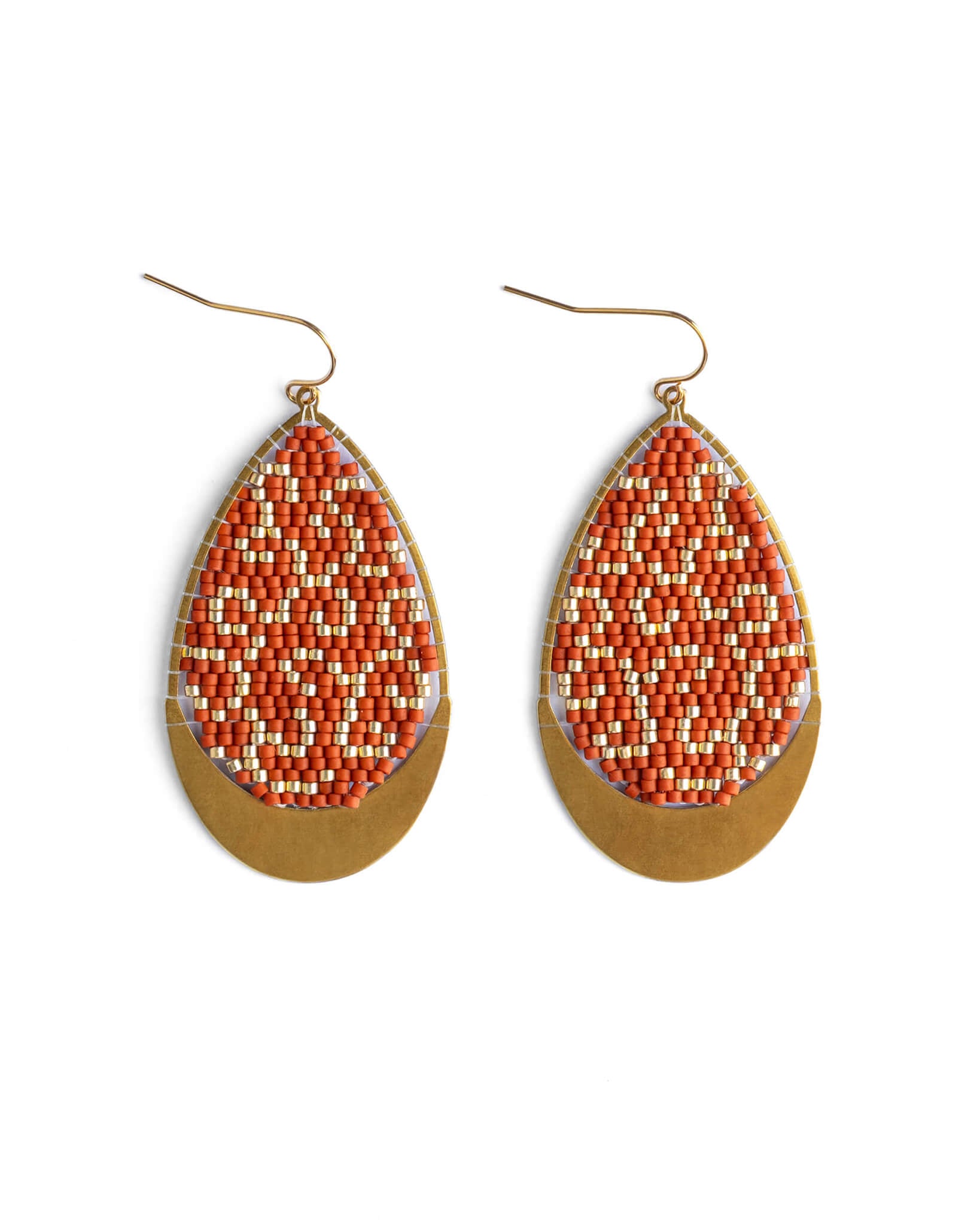 Teardrop-shaped earrings with orange and gold design on a white background