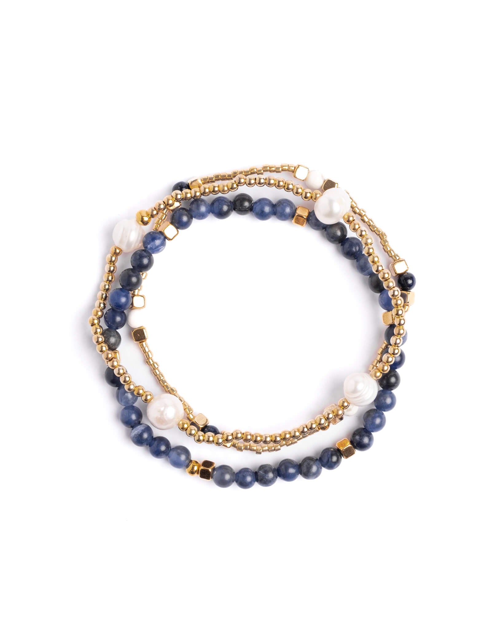 Stack of blue beaded bracelets with gold accents on a white background