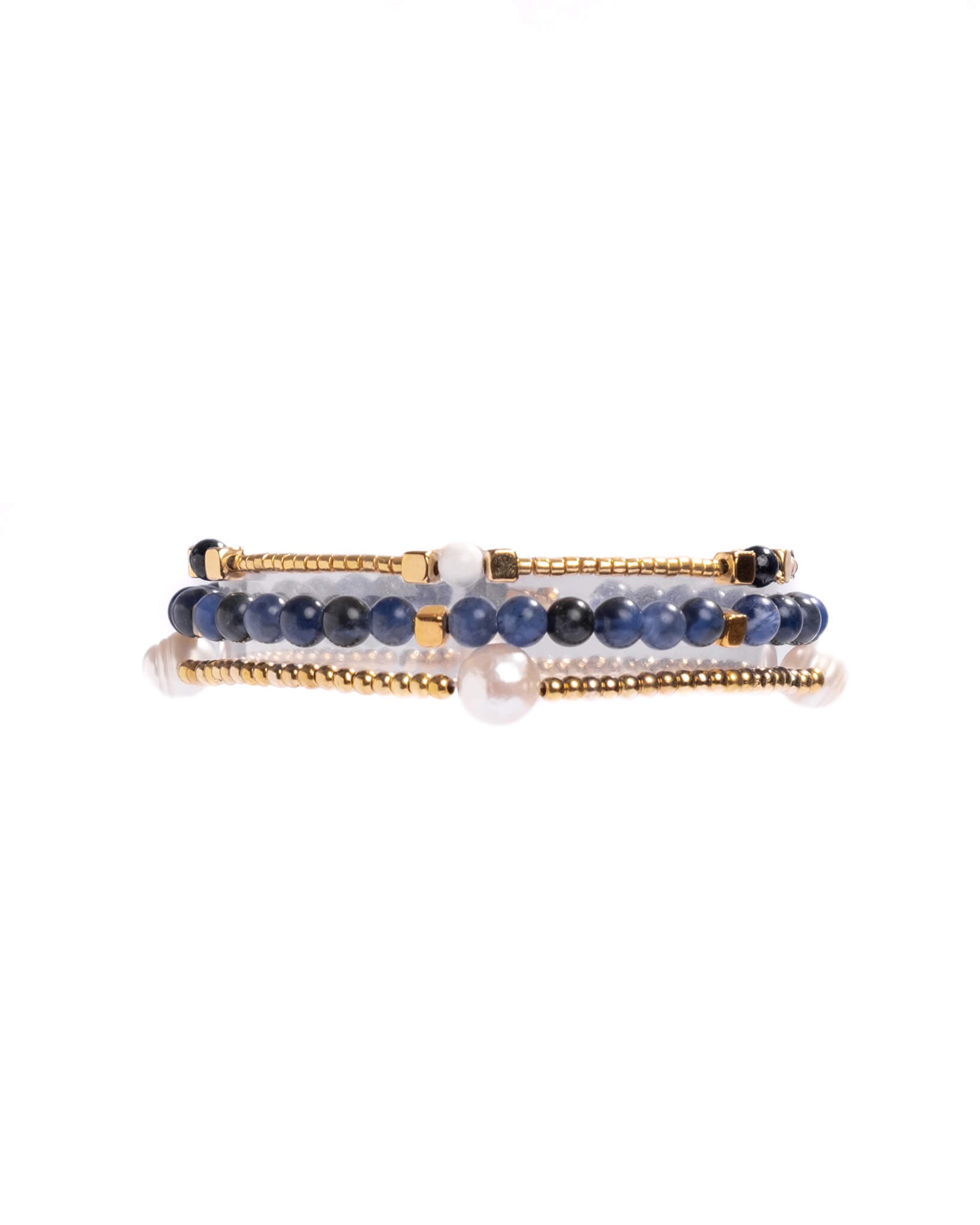 Set of three bracelets with blue beads and gold accents on a white background